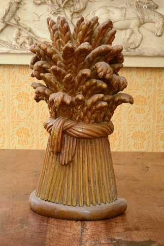 A large carved wooden wheatsheaf,