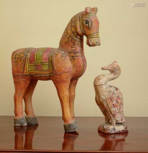 A carved and painted wooden horse,