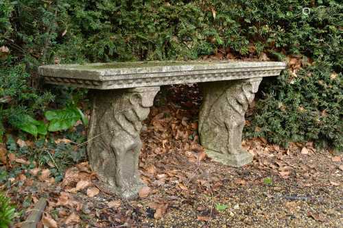 A pair of reconstituted stone garden seats,