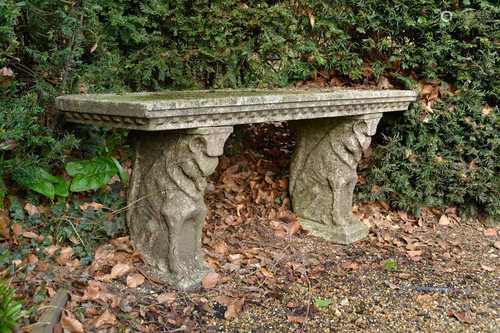 A pair of reconstituted stone garden seats,