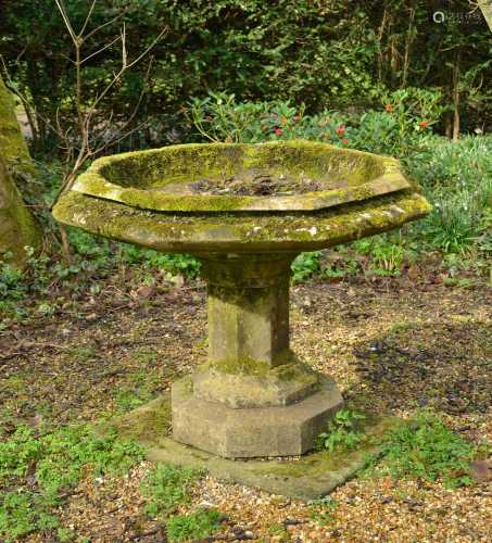 An octagonal carved marble font,