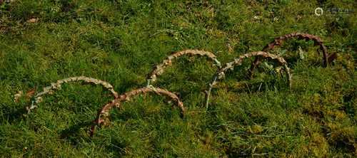 A set of cast iron hoops,