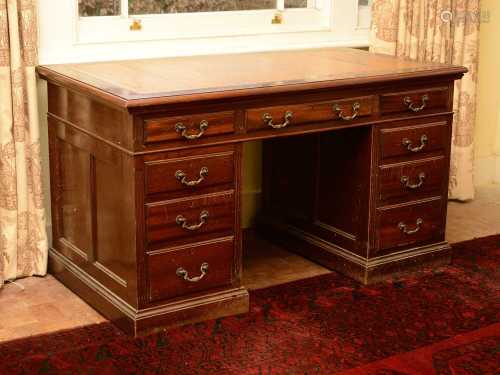 A reproduction mahogany pedestal desk,