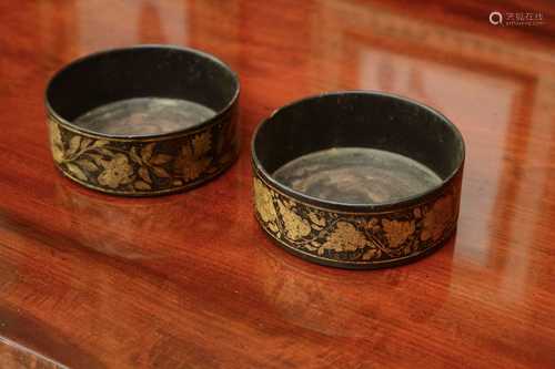 A near pair of Regency papier-mâché bottle coasters,