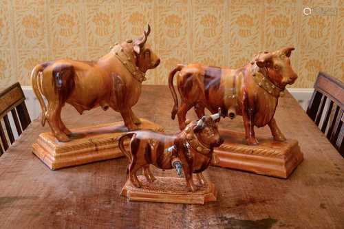 A large Portuguese treacle-glazed pottery figure of a bull,