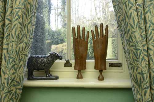A pair of carved beech glovemaker's lasts,
