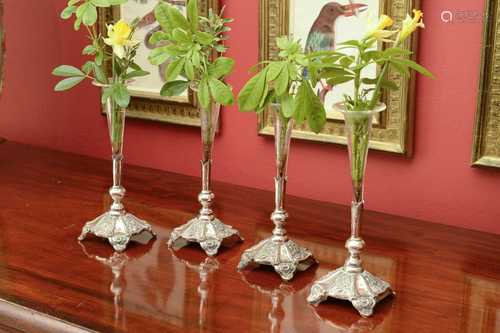 A set of four silver plate and glass posy vases,