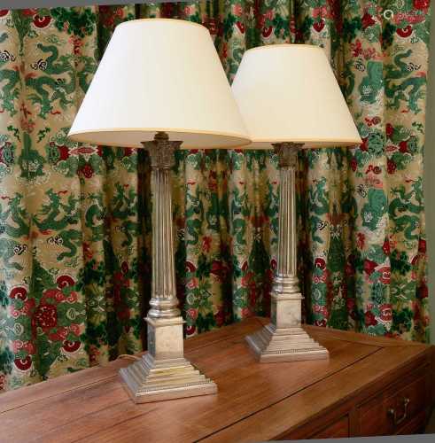 A pair of silver-plated Corinthian column table lamps,