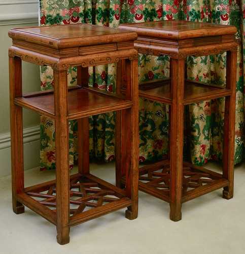 A pair of Chinese elm bedside tables or urn stands,