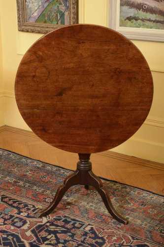A George III mahogany tilt-top supper table,