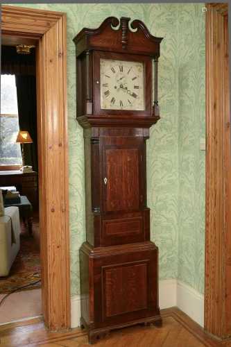 An oak and mahogany longcase clock,