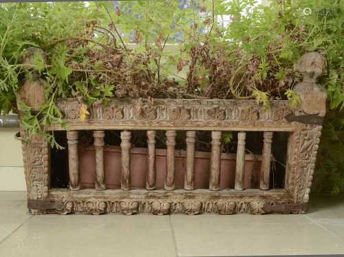 A carved hardwood manger/plant stand,