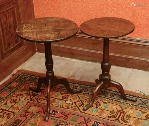 Two similar oak circular occasional tables,