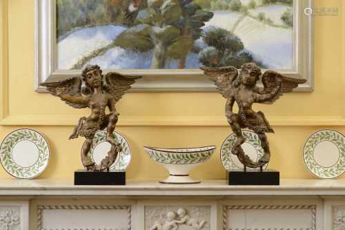 A pair of carved, polychrome painted and gilt angel figures,