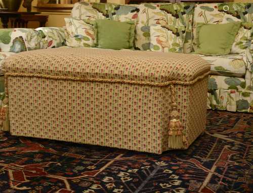 A large upholstered ottoman,