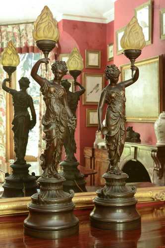 A pair of bronzed spelter figural table lamps,