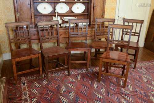 A set of six George III oak dining chairs