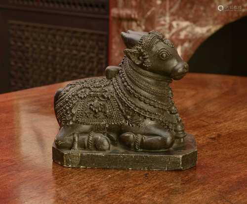 An Indian carved stone figure of Nandi,