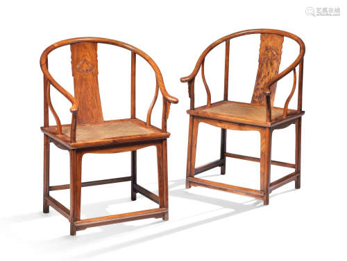 A RARE PAIR OF HUANGHUALI HORSESHOE-BACK ARMCHAIRS, QUANYI 1...