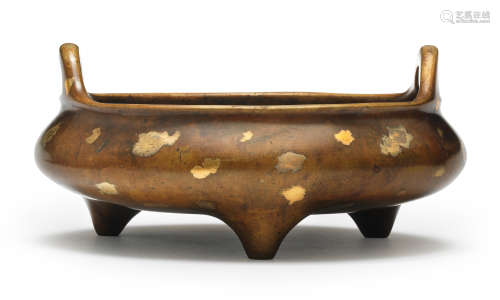 A large gold-splashed bronze tripod incense burner, ding Xua...