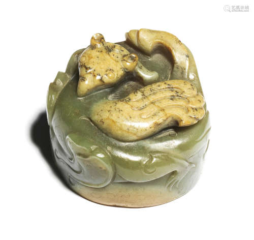 A RARE PALE GREEN AND RUSSET JADE 'MYTHICAL BIRD' SCROLL WEI...