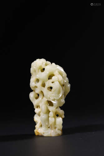 A Carved Jade Figure with a Scholar Rock, 18th Century, Qing...