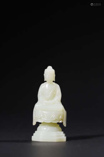 A Carved Jade Figure of a Seated Buddha