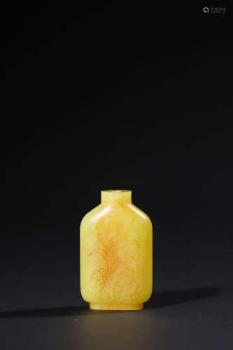 A Carved Yellow Jade Snuff Bottle