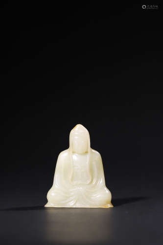 A Carved White Jade Figure of a Seated Buddaha