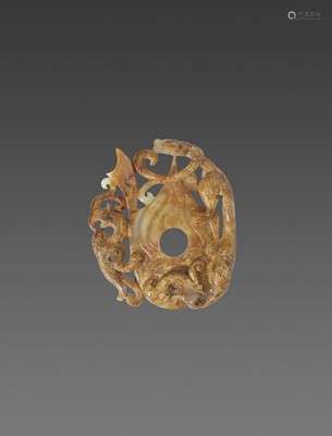 A JADE ORNAMENT IN THE SHAPE OF AN ARCHER’S RING WITH A PHOE...