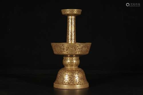 A TEA-DUST-GLAZED GILT CANDLE STICK