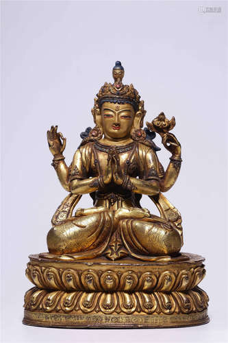 A CHINESE GILT-BRONZE FIGURE FOUR-ARMED GUAN YIN 