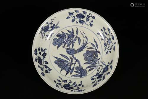 A BLUE AND WHITE FLOWER AND BIRD PLATE