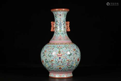 A TURQUOISE-GROUND FAMILLE ROSE FLOWER VASE