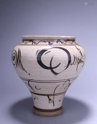 A CIZHOU KILN WHITE-GLAZED WITH BLACK FLOWER JAR 