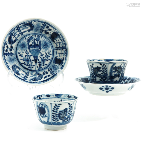 A Pair of Blue and White Cups and Saucers