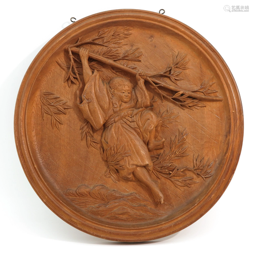 A Round Carved Wood Panel