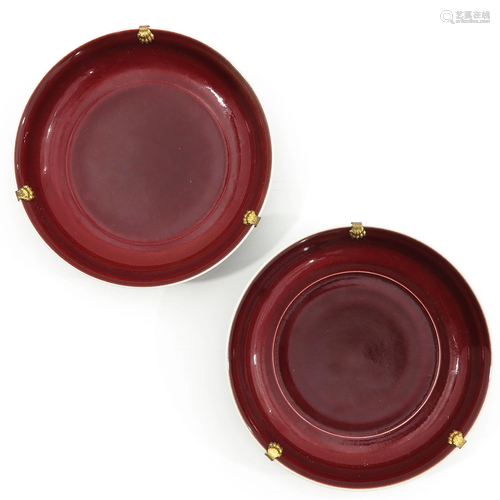 A Pair of Sang de Boeuf Plates