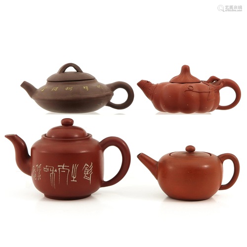 A Collection of 4 Yixing Teapots