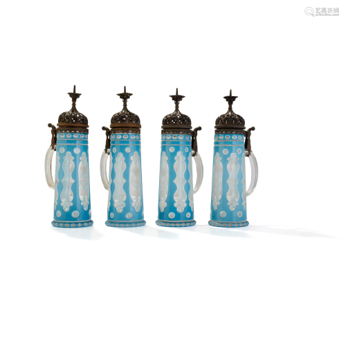 FOUR BOHEMIAN LAYERED GLASS TANKARDS ENGRAVED WITH …