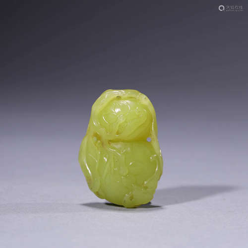 A Carved Yellow Jade Double-Gourd-Shaped Pendant