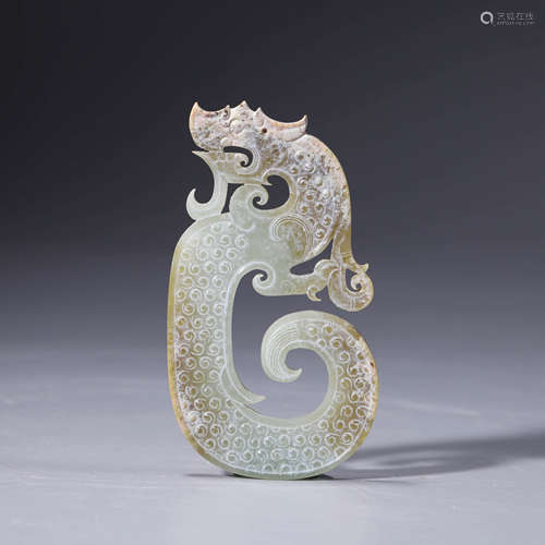 A Carved Celadon Jade Dragon Ornament