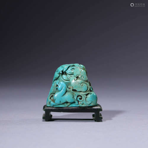 A Turquoise Carving Of A Mythical Beast