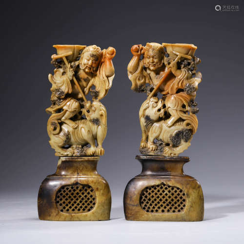 A Pair Of Carved Stone Candlesticks