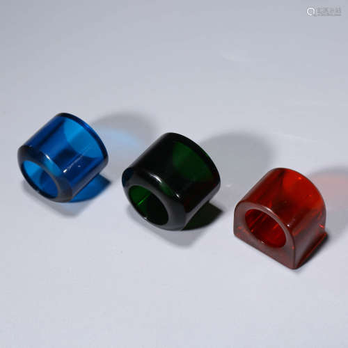A Set Of Three Glass Thumb Rings