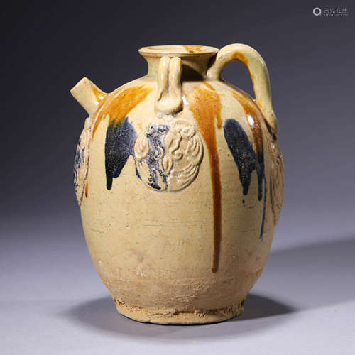 A Sancai-Glazed Relief-Decorated Pottery Ewer