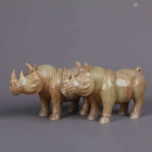 A Pair Of Russet Jade Rhinoceros