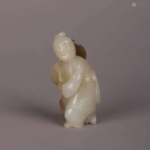 A Jade Carving Of A Child
