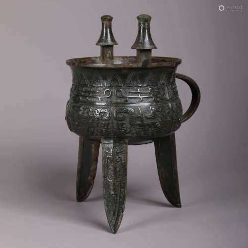 An Archaistic Bronze Tripod Wine Vessel