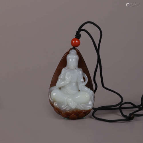 A Carved Jade Lotus Guanyin Pendant